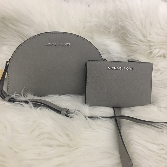 Michael Kors Handbags - Firm❗️Michael Kors half moon Crossbody bag &wallet